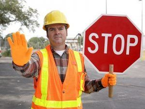construction worker stop sign